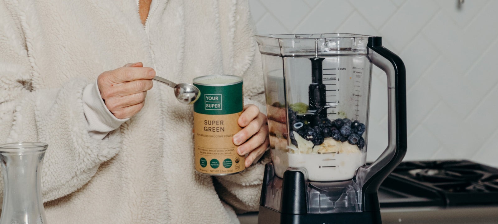 Woman preparing a Super Green smoothie